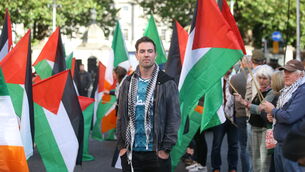 <p>Gaelic footballer Michael Darragh MaCauley at a rally to deliver an 'Enact the Occupied Territories Bill' petition to the Dáil. A range of civil society organisations, trade unions, academics, and politicians have been campaigning to pass the bill. Picture: Stephen Collins/Collins </p> <p>Gaelic footballer Michael Darragh MaCauley at a rally to deliver an 'Enact the Occupied Territories Bill' petition to the Dáil. A range of civil society organisations, trade unions, academics, and politicians have been campaigning to pass the bill. Picture: Stephen Collins/Collins </p>
