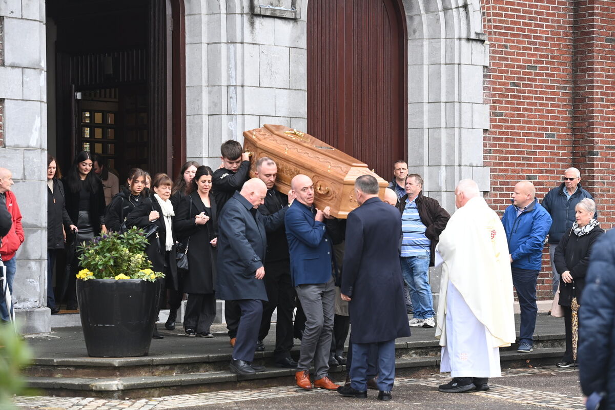 Mourners carry the coffin of former priest, Paul O'Donoghue, out of the Church of the Assumption in Ballyphehane at his funeral mass. Picture: Larry Cummins