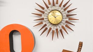<p>Sunburst wall clock with teak wood at RetroFern Vintage, Midcentury and Retro Interiors at Quay Co-op.</p>