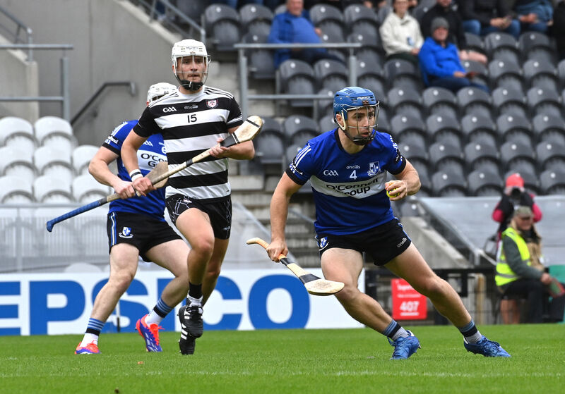 'SOMETHING POSITIVE IN HARDSHIP': Sarsfields' Conor O'Sullivan getting away from David Cremin, Midleton. Pic: Dan Linehan