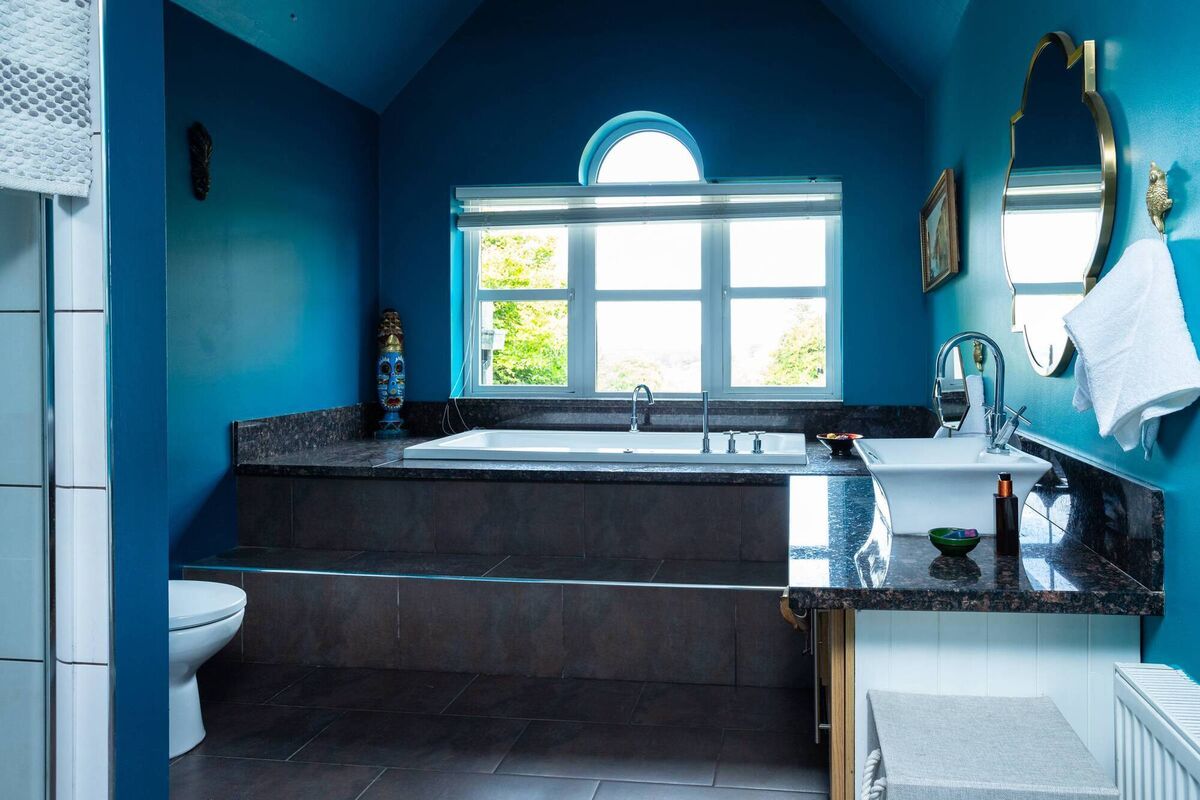 Bathroom with vaulted ceiling and feature bath