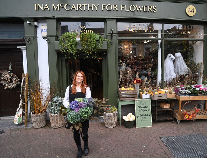 Florist Rachel McCarthy at Ina McCarthy for Flowers on Main Street, Midleton, a year on from the devastating flooding in October 2023. Picture: Larry Cummins