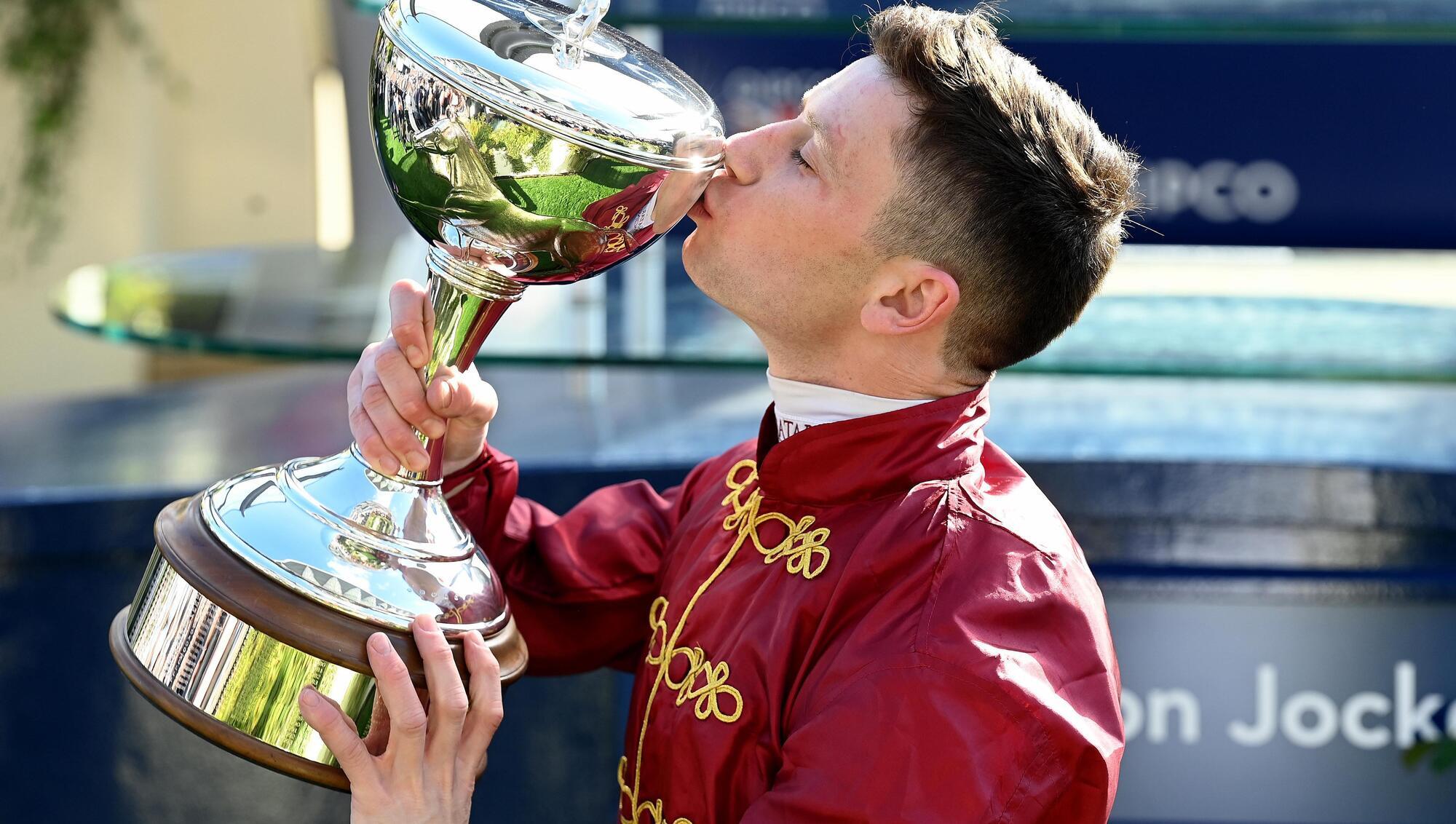 FOURMIDABLE: Jockey Oisin Murphy is crowned Champion for the 4th time pictured kissing the trophy. Pic: Healy Racing.
