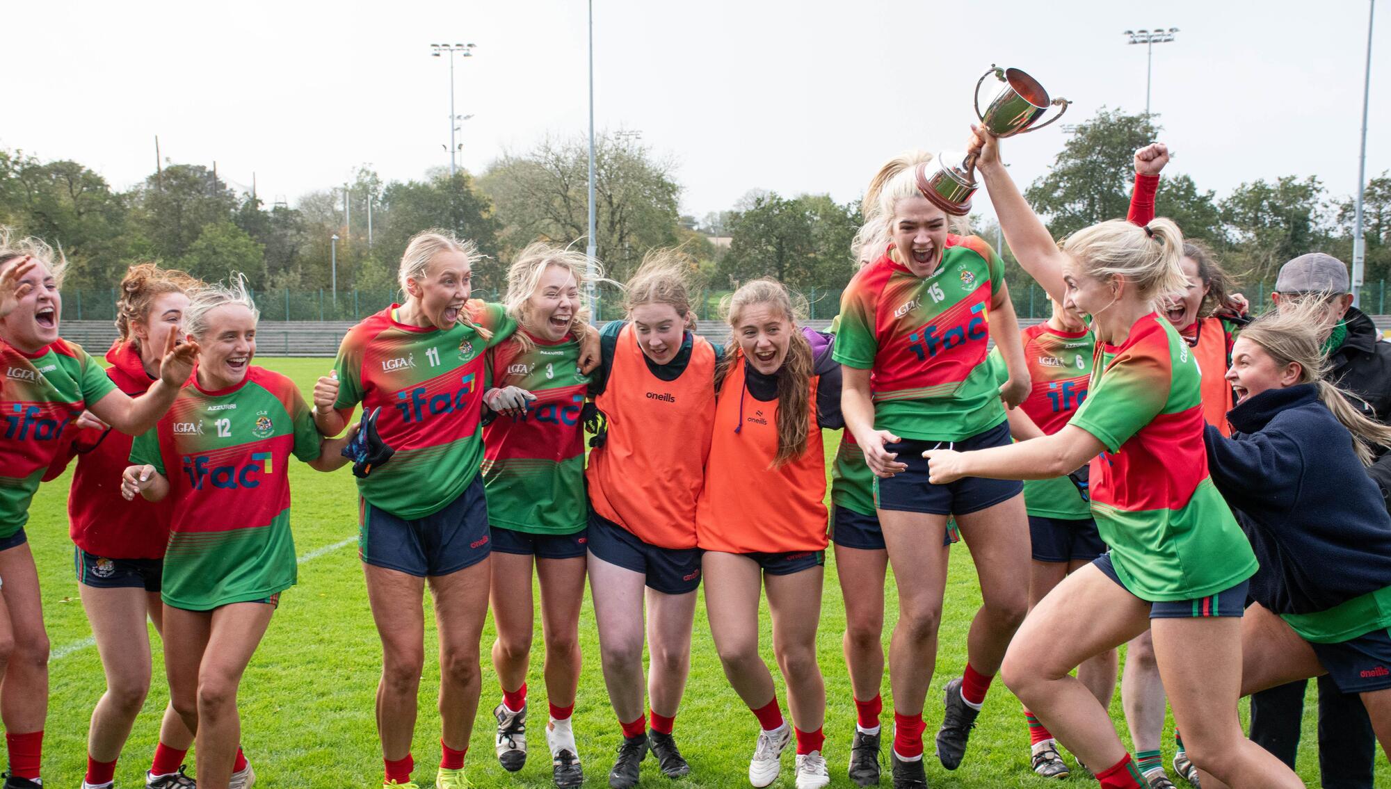  CHAMPIONS: Clonakilty captain Meabh O'Donovan runs towards her team mates with the LGFA Senior B trophy. Pic: Howard Crowdy