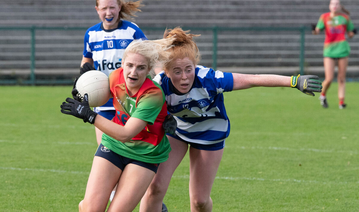 Clonakilty's Meabh O'Donovan manages to keep the ball well away from Kinsale's Juliet Cronin. Pic: Howard Crowdy Clonakilty's Meabh O'Donovan manages to keep the ball well away from Kinsale's Juliet Cronin. Pic: Howard Crowdy