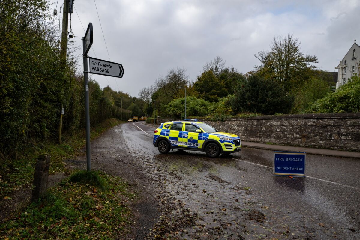 GardaĂ close a road in Rochestown, Cork, due to power lines being blown down by Storm Ashley. Picture: Chani Anderson GardaĂ close a road in Rochestown, Cork, due to power lines being blown down by Storm Ashley. Picture: Chani Anderson