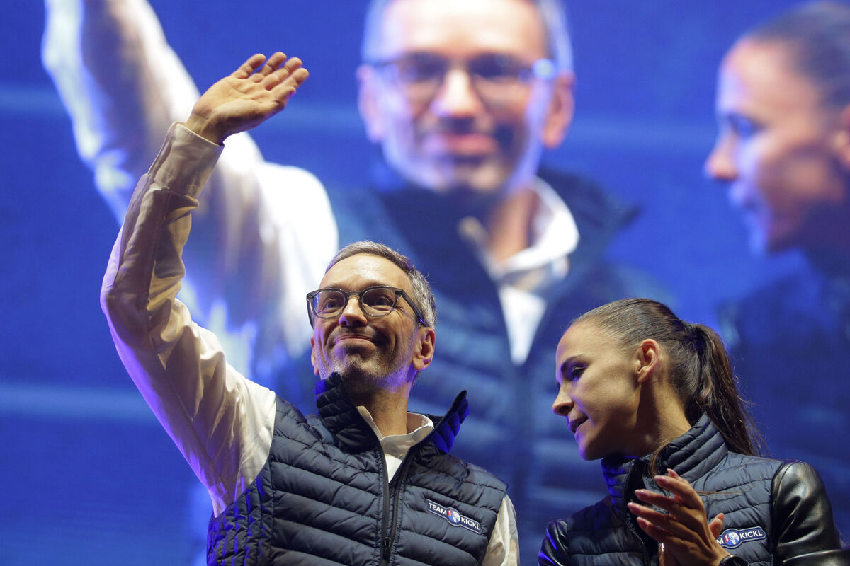 Head of the Freedom Party Herbert Kickl, left, waves to supporters beside party colleague Susanne Fuerst after his speech at a final election campaign event at St. Stephen's square in Vienna last September. Its repeated inclusion in national government over the years maybe ultimately helped it win September’s elections. Photo: AP/Heinz-Peter Bader