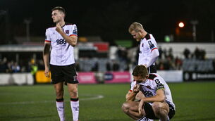 <p>Dundalk players, from left, Hayden Cann, Daryl Horgan and John Mountney react to the club's relegation. Pic: Ben McShane/Sportsfile</p>