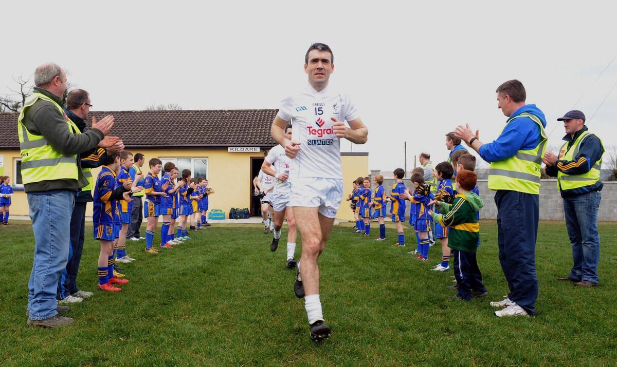 Kildare captain Johnny Doyle leads his side out for a senior football challenge match against Kerry at the Ballymacelligott GAA Club official pitch reopening. Picture: Eamonn Keogh Kildare captain Johnny Doyle leads his side out for a senior football challenge match against Kerry at the Ballymacelligott GAA Club official pitch reopening. Picture: Eamonn Keogh