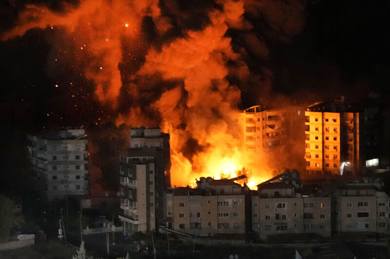 Flames rise from buildings hit by Israeli airstrikes on Dahiyeh, Beirut, on Wednesday. Picture: Hussein Malla/AP