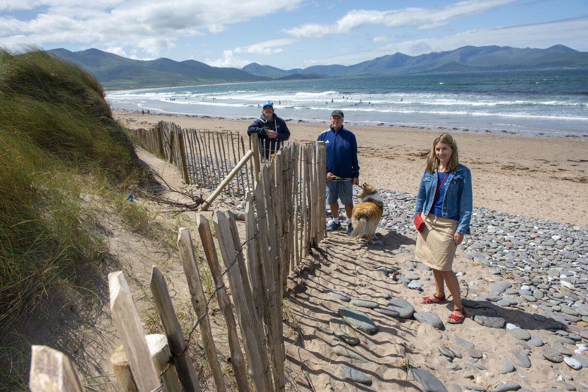 (Left to right) Eugene Farrell, University of Galway, Martin Lynch and Martha Farrell of the Maharees Conservation Association stand next to a fence which has been erected to protect against the erosion of the sand dunes on Magherabeg Cut beach on the Maharees peninsula in West Kerry. Picture: Dan Linehan