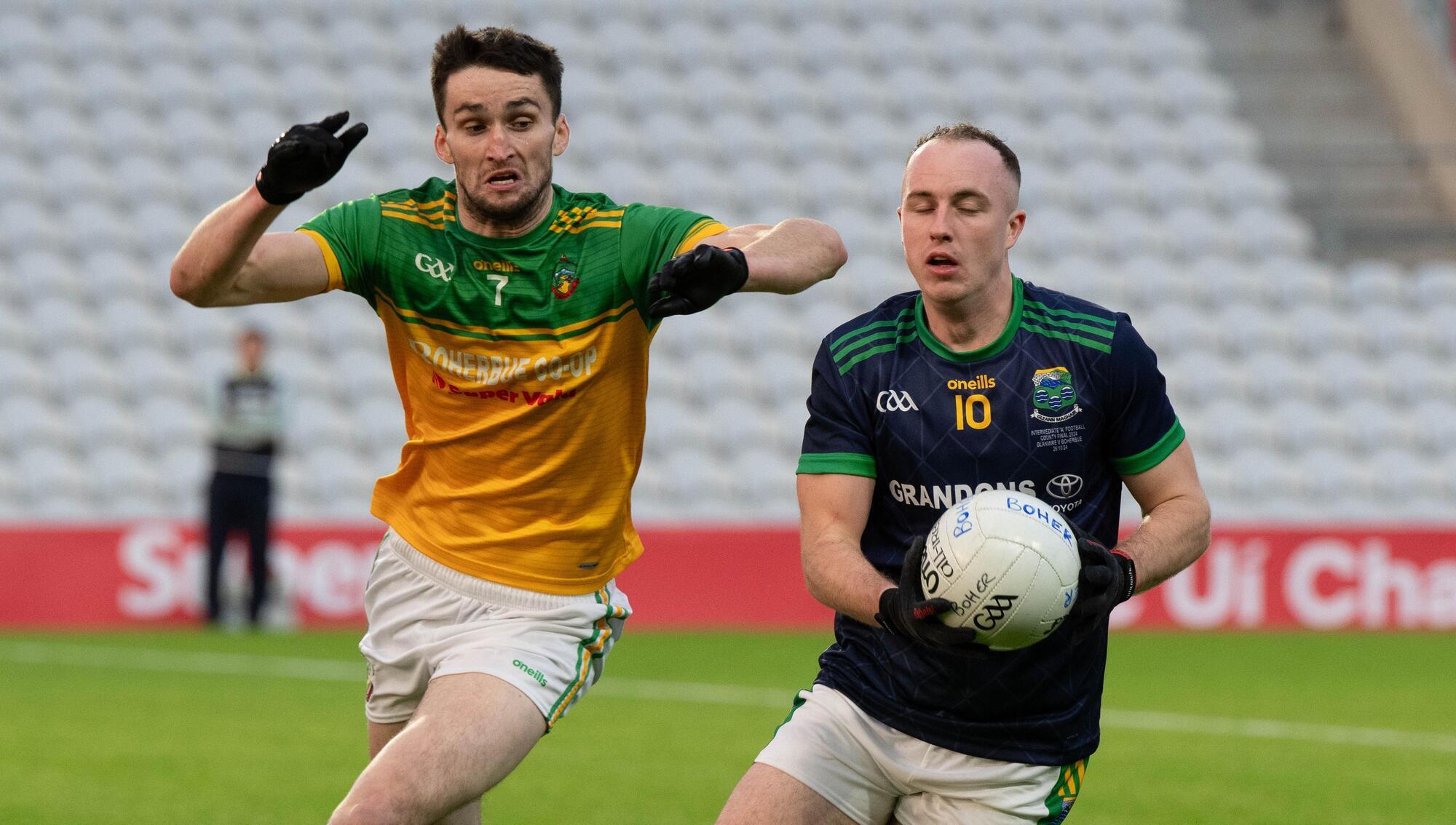 Glanmire's Daniel Hogan holds possession ahead of Boherbue's Brian Murphy during the Intermediate A Football Championship final in Super Valu Pairc Ui Chaoimh Picture: Howard Crowdy