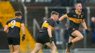 <p>CHAMPIONS: Dr. Crokes Evan Looney celebrates scoring his sides third goal. Picture: ©INPHO/Ken Sutton</p>