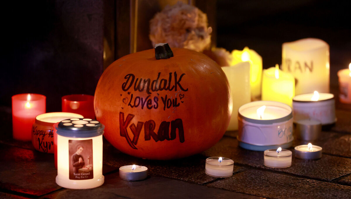 A pumpkin and candles among other tributes places during a vigil for Kyran Durnin in Market Square, Dundalk. Picture: Liam McBurney/PA A pumpkin and candles among other tributes places during a vigil for Kyran Durnin in Market Square, Dundalk. Picture: Liam McBurney/PA