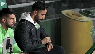 <p>TIME TO GO: Sporting's head coach Ruben Amorim checks his watch during a Portuguese League Cup match. Pic: AP Photo/Ana Brigida.</p>