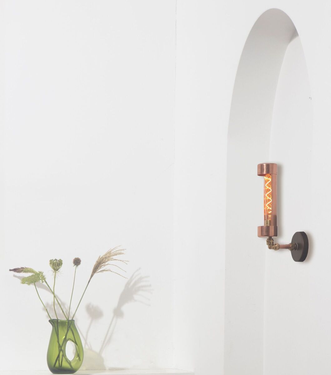  Wall lights are a warming alternative to the central ceiling light, like the Liberties sconce from Copperfish.
