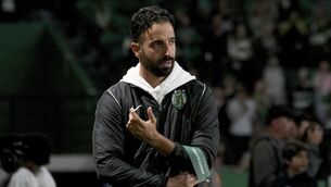 <p>DELAY: Sporting's head coach Ruben Amorim adjusts his coach armband during Tuesday's Portuguese League Cup match. Pic: AP Photo/Ana Brigida.</p>