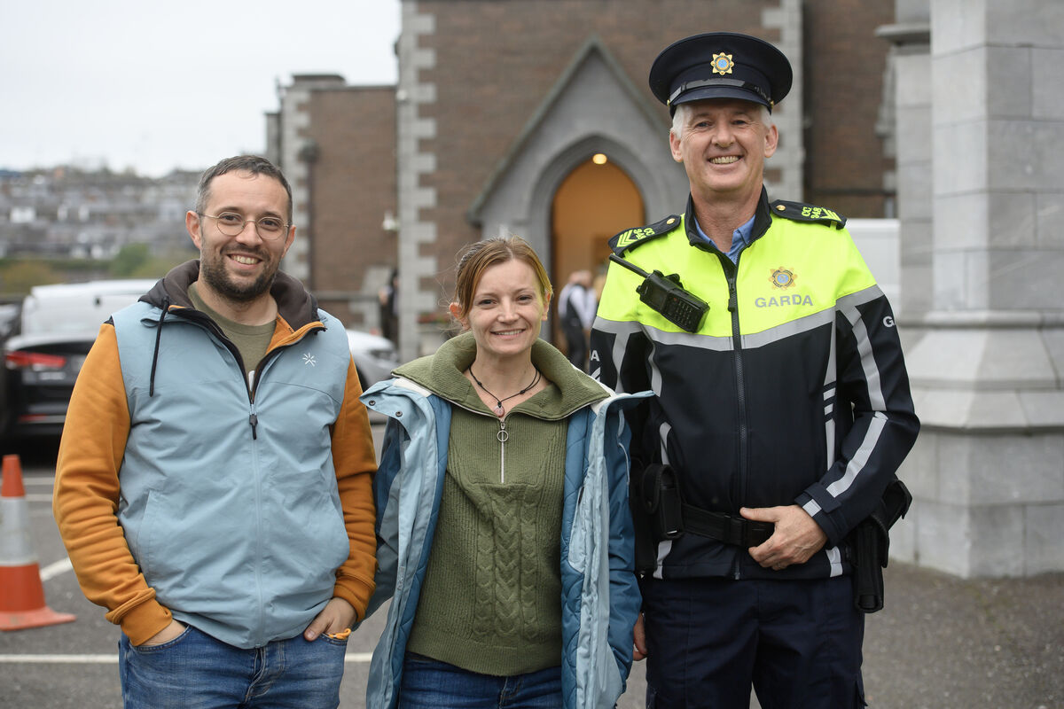 Sergeant Tom McCarthy, Watercourse Road Garda Station, with French holidaymakers Philippe Marcatel and Mylene Bardiau who were delighted to discover Saint Bernadette's relics were on display in Cork during their trip. Picture: Dan Linehan