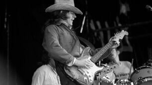 <p>Rory Gallagher playing his instantly-recognisable Fender Stratocaster at the Macroom Mountain Dew Festival in Co Cork on June 26, 1977. Picture: Irish Examiner Archive</p>