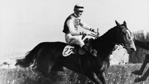<p>Cottage Rake and jockey Aubrey Brabazon take the final fence to win the Cheltenham Gold Cup in April 1948</p>