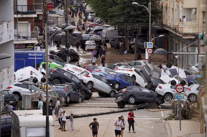 Vehicles are seen piled up after being swept away by floods in Valencia, Spain, Thursday, October 31, 2024. 