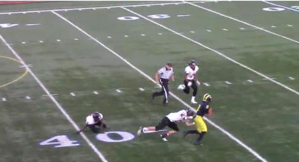 Ferocious teenage football player barges through opponents