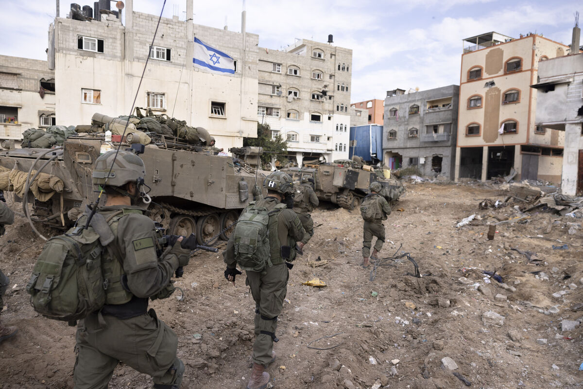 Israeli soldiers walk in Gaza City's Shijaiyah neighborhood on Dec. 8, 2023, as part of an operation to round up hundreds of Palestinians across the northern Gaza Strip and truck some to an undisclosed location. (AP Photo/Moti Milrod, Haaretz, File) Israeli soldiers walk in Gaza City's Shijaiyah neighborhood on Dec. 8, 2023, as part of an operation to round up hundreds of Palestinians across the northern Gaza Strip and truck some to an undisclosed location. (AP Photo/Moti Milrod, Haaretz, File)