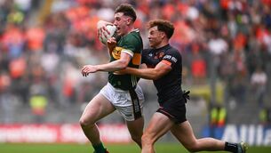 <p>HEADING DOWN UNDER: Cillian Burke of Kerry in action against Jason Duffy of Armagh. Photo by Seb Daly/Sportsfile</p>