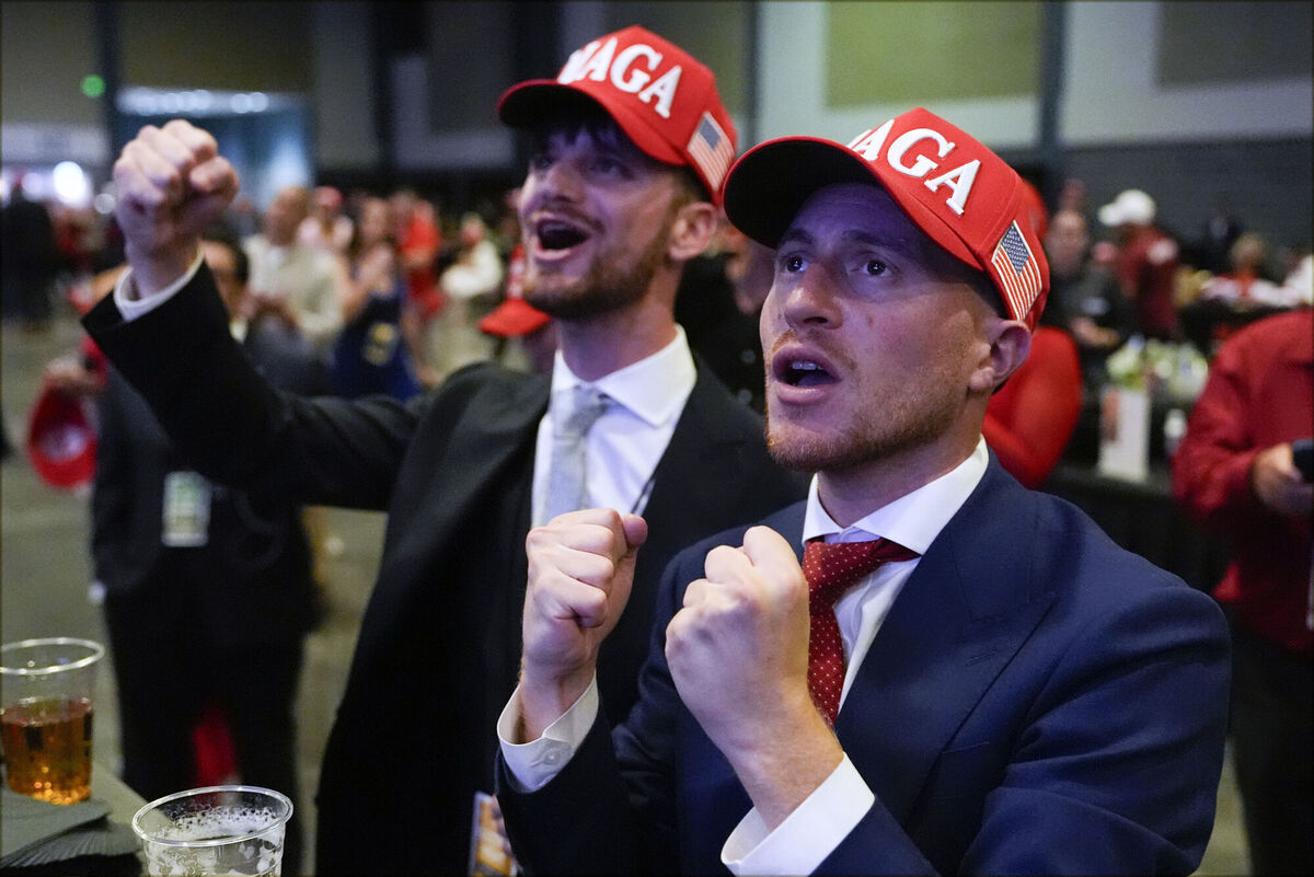 Supporters arrive at an election night watch party for Donald Trump. Picture: AP Photo/Julia Demaree Nikhinson