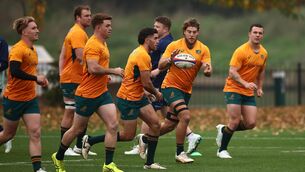 <p>Australia's flanker Fraser McReight (2R) attends the Captain's run training session. Photo by HENRY NICHOLLS/AFP via Getty Images.</p>