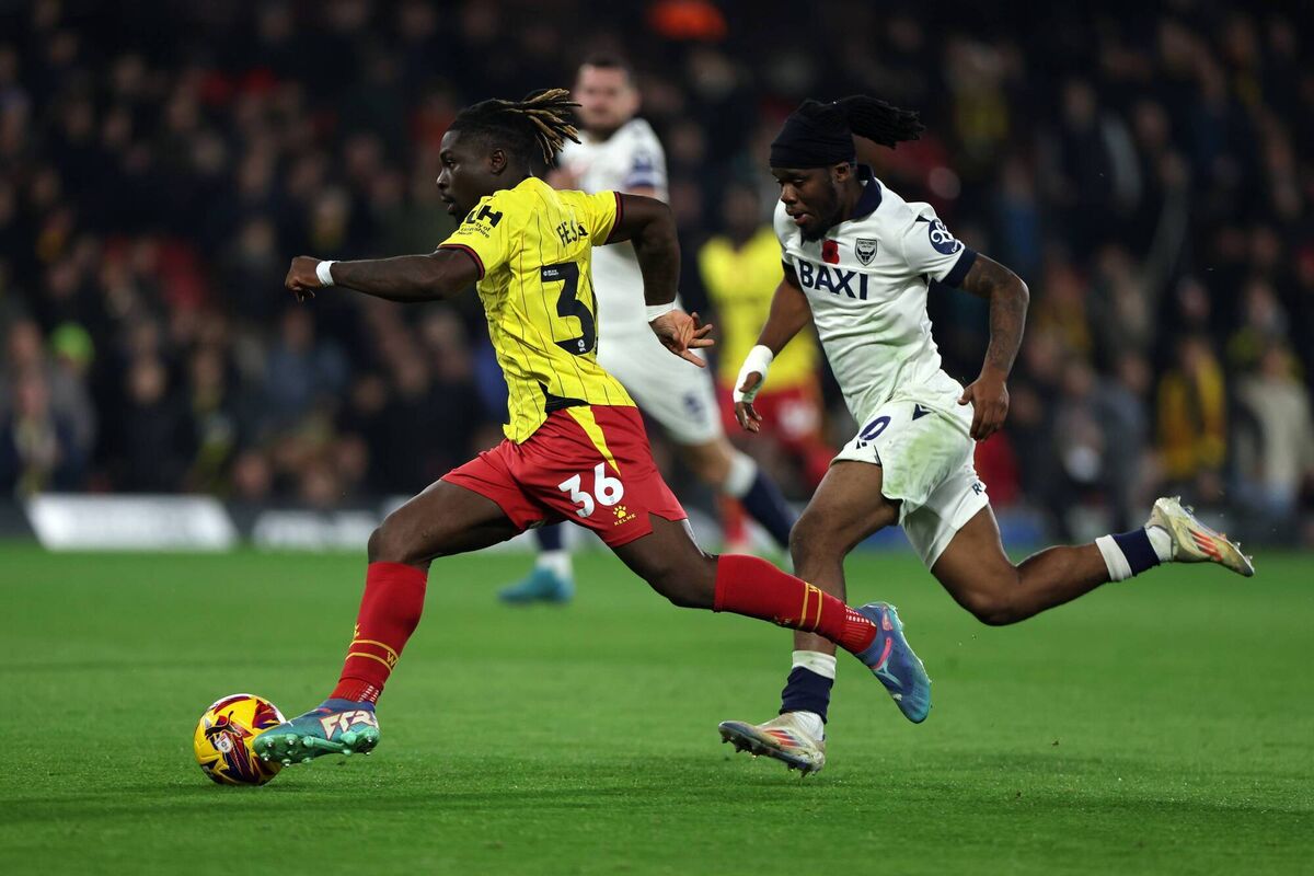Festy Ebosele is tackled by Peter Kioso of Oxford United. Photo by Harry Murphy/Getty Images.