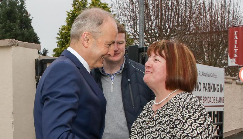 Tánaiste Micheál Martin meets his second cousin Margaret Walsh O'Brien while out canvassing in Carrigtwohill. Picture: David Creedon