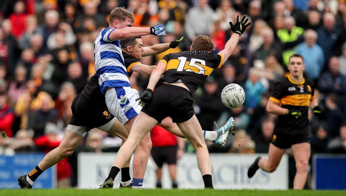 BATTLE: Jack O'Neill of Castlehaven gets a kick away despite the attention Brian Looney, and Cian McMahon of Dr Crokes. Pic: Michael P Ryan/Sportsfile