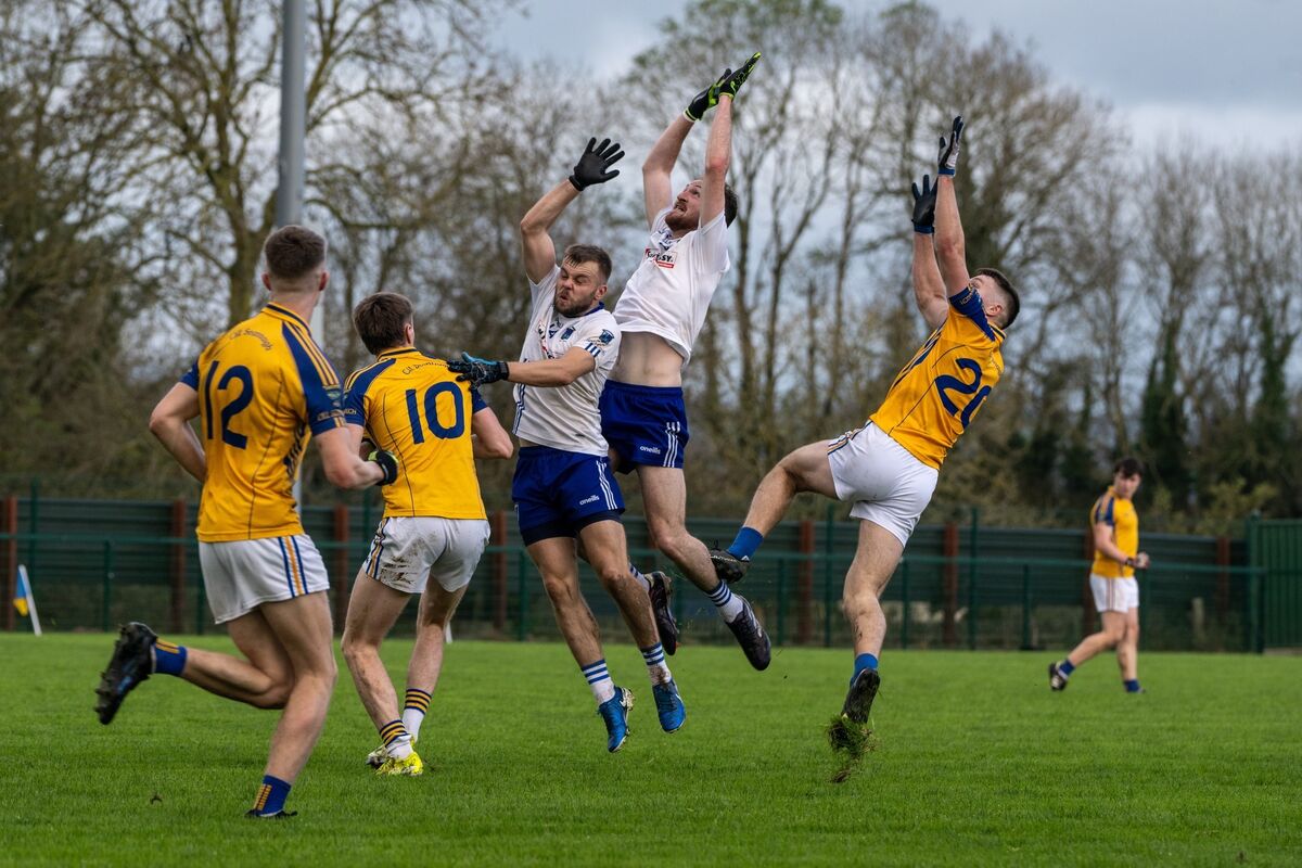 Rathkeale’s Barry Coleman and Mikey Morrissey battle in the air against Kilshannig’s Ciaran O’Sullivan. Pic: Chani Anderson