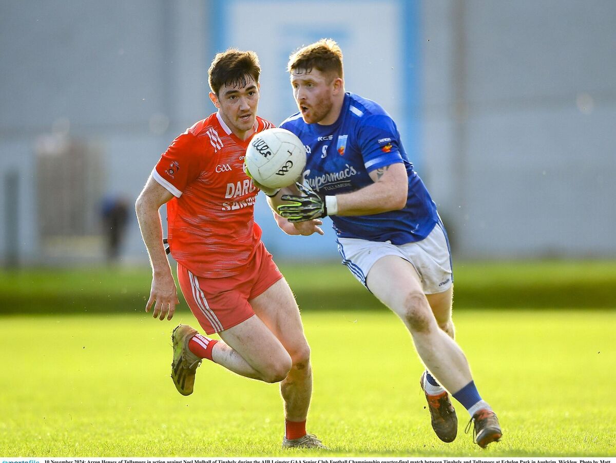 Aaron Hensey of Tullamore in action against Noel Mulhall. Aaron Hensey of Tullamore in action against Noel Mulhall.