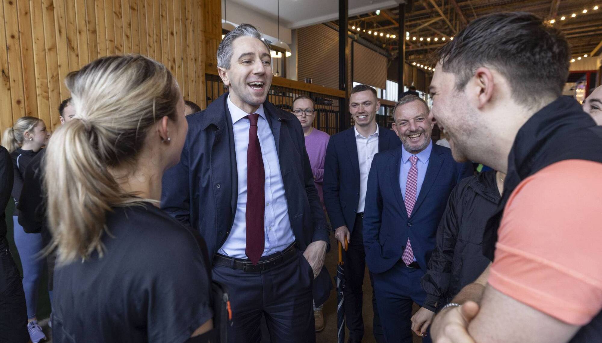 Outgoing taoiseach Simon Harris meeting runners and community members at Runday Club Cork on Sunday morning. Picture: Fergal Phillips/PA  