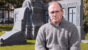 <p>Gabriel Doherty photographed in 2012 beside the Republican graves and monument at UCC. Picture: Tomás Tyner/UCC</p>