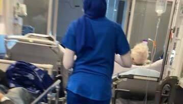 Staff at University Hospital Limerick wheeling a trolley carrying a patient into a corridor in the hospital’s cramped Emergency Department in February. One report noted exhaustion among staff amid 'persistent overcrowding' and 'ongoing adverse publicity'.
