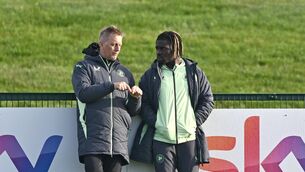 <p>Head coach Heimir Hallgrimsson, left, in conversation with Festy Ebosele during a Republic of Ireland training session at the FAI National Training Centre in Abbotstown, Dublin. Photo by Ben McShane/Sportsfile</p>