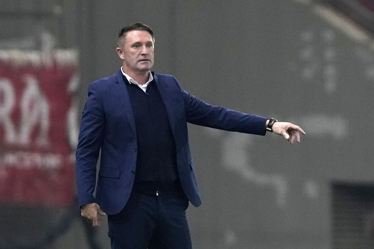 Head coach Robbie Keane instructs his players during the round of 16 soccer game between Olympiacos and Maccabi Tel Aviv at Georgios Karaiskakis stadium, Piraeus port near Athens, Greece on Thursday (Picture: AP Photo/Thanassis Stavrakis)