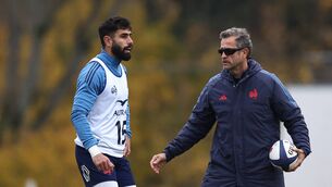 <p>France's full-back Romain Buros (L) and France's head coach Fabien Galthie.</p>