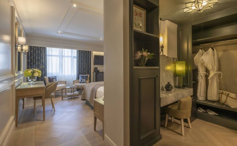 The hotel’s elegant rooms and suites offer a blend of modern comfort and classic luxury.