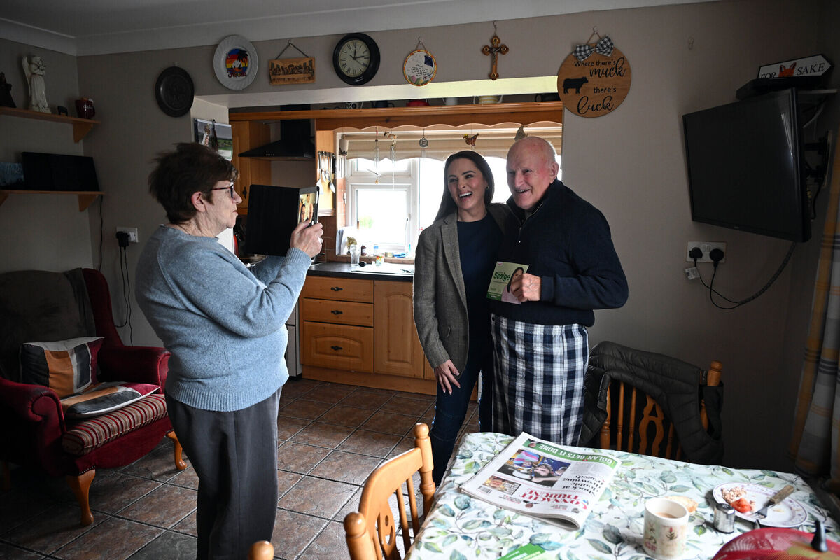 Mary O’Toole takes a photograph of Fianna Fáil election candidate for Galway West Gráinne Seoige with Mairtín O’Toole in their house in Connemara.	Picture: Ray Ryan