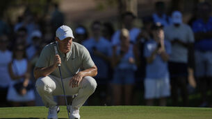 <p>TITLE-HUNTING: Rory McIlroy of Ireland lines up a putt on the 8th green. Pic: Altaf Qadri</p>