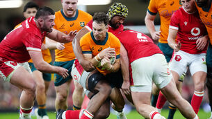 Australia’s Nic White (centre) is tackled by Wales’ Dewi Lake (right) and Christ Tshiunza (David Davies/PA)