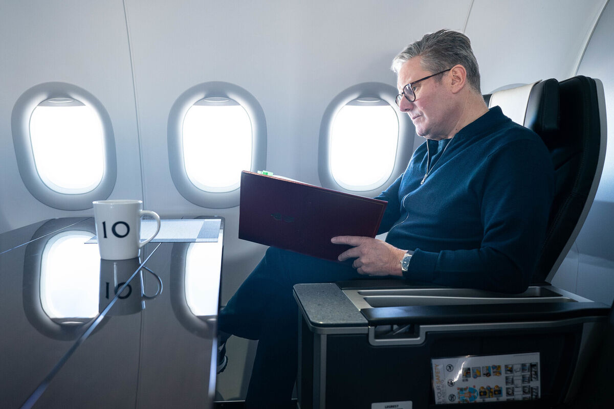 Prime Minister Sir Keir Starmer works on board a Government plane as he travels to Rio de Janeiro, Brazil to attend the G20 summit. Picture date: Sunday November 17, 2024.