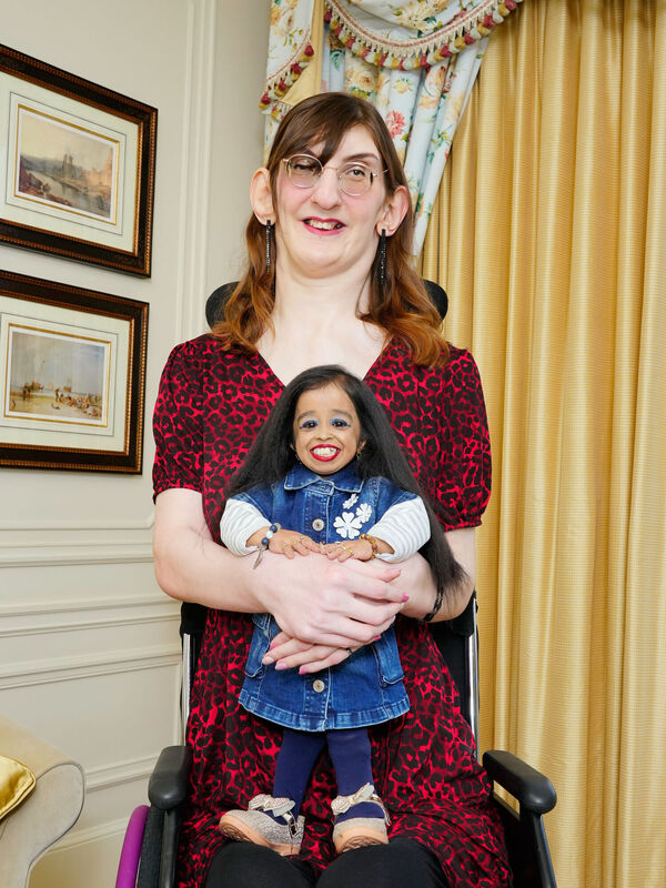 Jyoti Amge, the world's shortest woman, and Rumeysa Gelgi, the world's tallest woman, meet for the first time and share afternoon tea at the Savoy Hotel, London. Picture: Michael Bowles/Guinness World Records