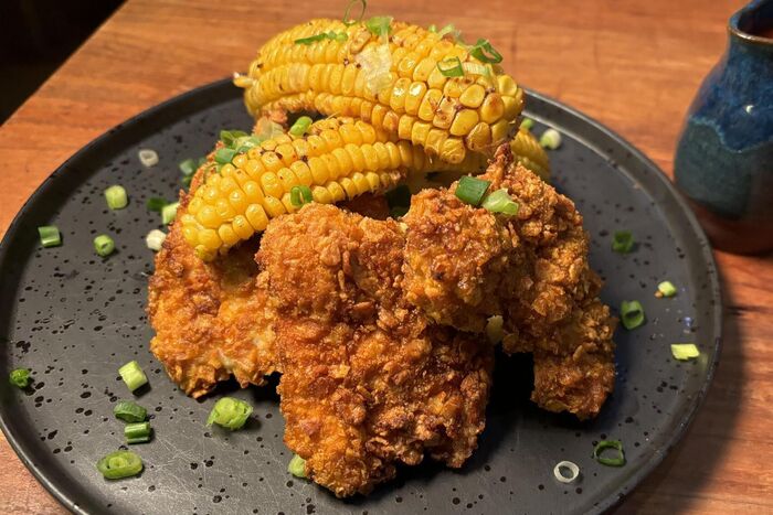 Corn-crusted chicken with hot sauce and corn ribs