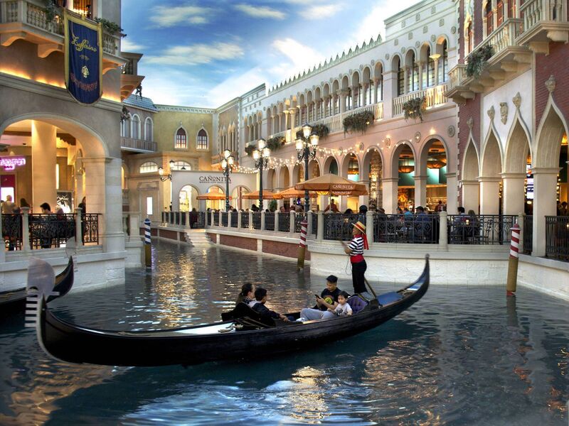 Tourists ride in a gondola inside the Venetian luxury hotel, casino and shopping complex on the Las Vegas Strip in Las Vegas, Nevada.