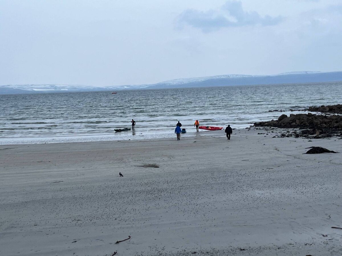 Kayakers return to the beach at Silverstrand after a body was found. Picture: Media West (Ireland) 